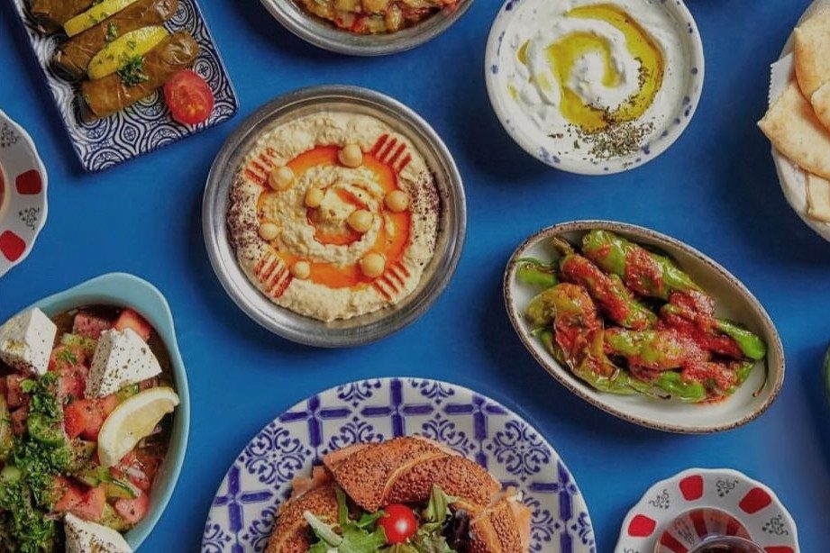 Turkish mezze spread on a bright blue table